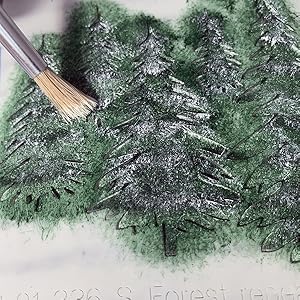 A Christmas Tree stencil being painted