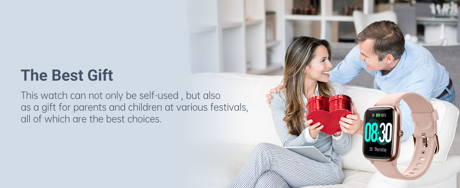 Smartwatch with red silicone band displayed on wrist. Image shows couple exchanging gift, suggesting the watch as a present.