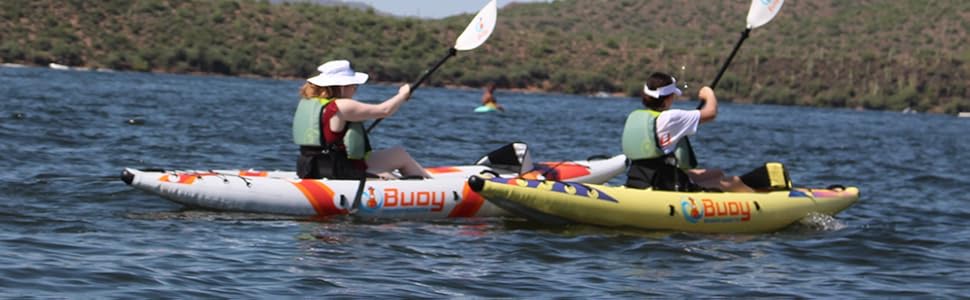 Two young women paddling on the lake with Buoy Watersports Echo and Havasu Inflatable Kayaks