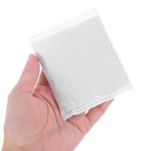 UPKOCH 6pcs Litter Box Filter Refills Odor Absorbing Carbon Filters for All Litter Boxes Quick Replacement for Clean Fresh Air Durable Filtration 13 Hand holding a small square of white mesh or filter material with textured surface.