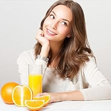 Young Woman pouring Orange juice