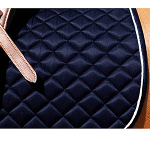 Detail shot of the diamond stitching and piping on the saddle pad