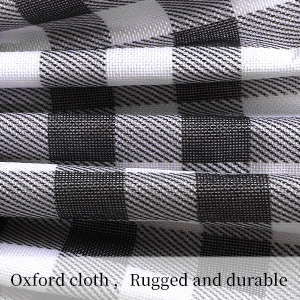 Close-up of black and white checkered fabric texture, identified as Oxford cloth. Text describes it as rugged and durable.