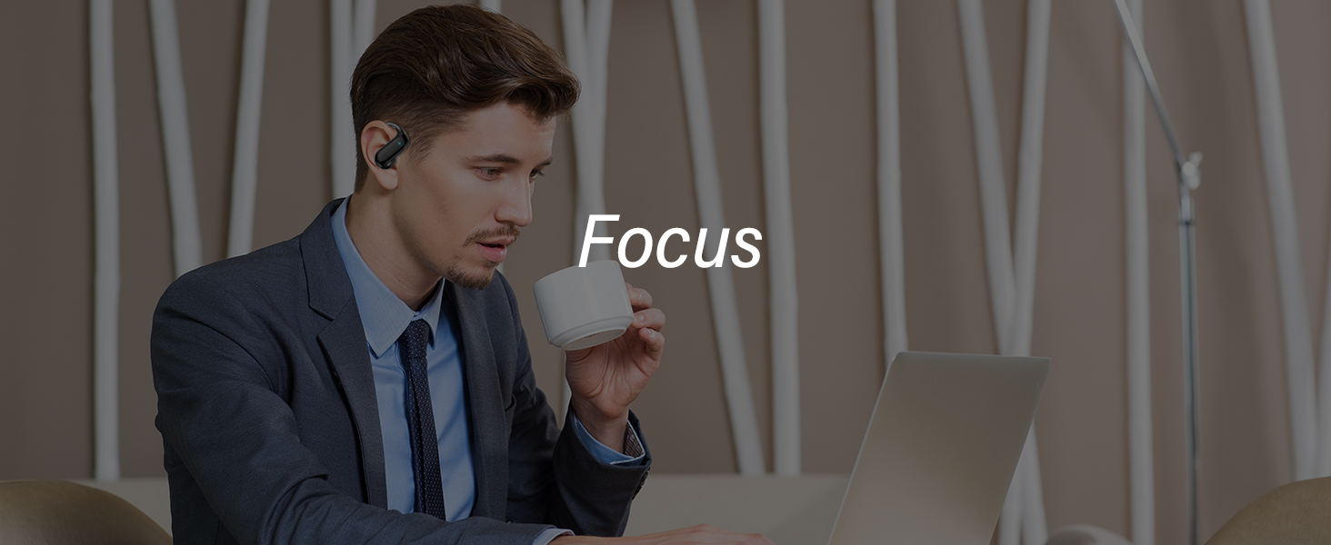 Man wearing a navy suit and blue tie using a laptop while wearing a small black wireless earbud in his right ear. The word 'Focus' appears in white text.