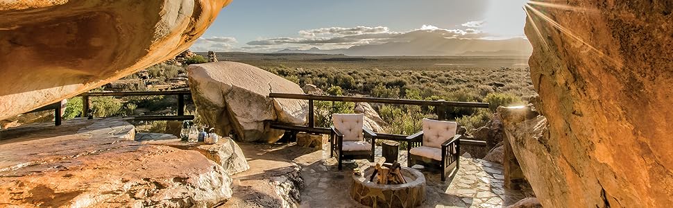 Unusual Hotels of the World: 50 unique hotels from around the World (Jonglez Photo Books) (Jonglez Photographic Journeys) 5 outdoor hotel, sunset, chairs, fire, rocks