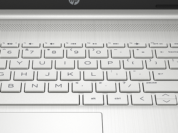 Work comfortably with a full-sized keyboard with integrated numeric pad