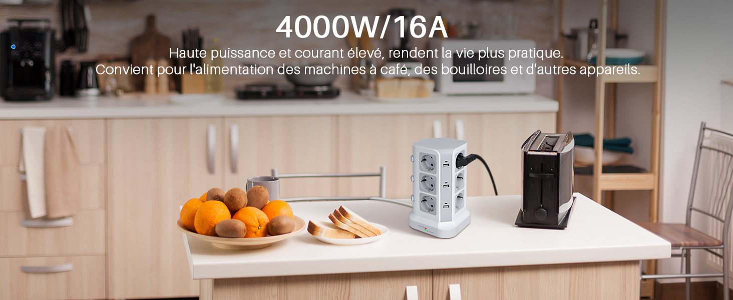 Plan de travail de cuisine moderne avec le texte des spécifications électriques indiquant « 4000W/16A », montrant des oranges et de petits appareils électroménagers