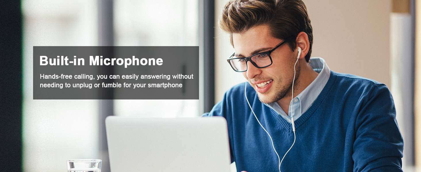 Text reads 'Built-in Microphone'. Person wearing blue sweater and glasses sitting at desk with computer monitor, wearing earphones.