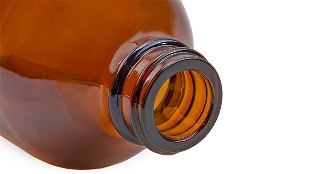 close up of neck of bottle on white background.