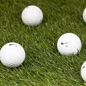 nike golf balls on turf grass