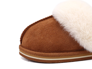 Brown suede slipper with white fur lining. Single shoe shown from the side against a white background.