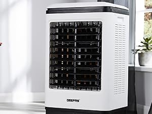 Close-up view of white electronic device with black button keyboard interface, shown from multiple angles in bright interior environment.