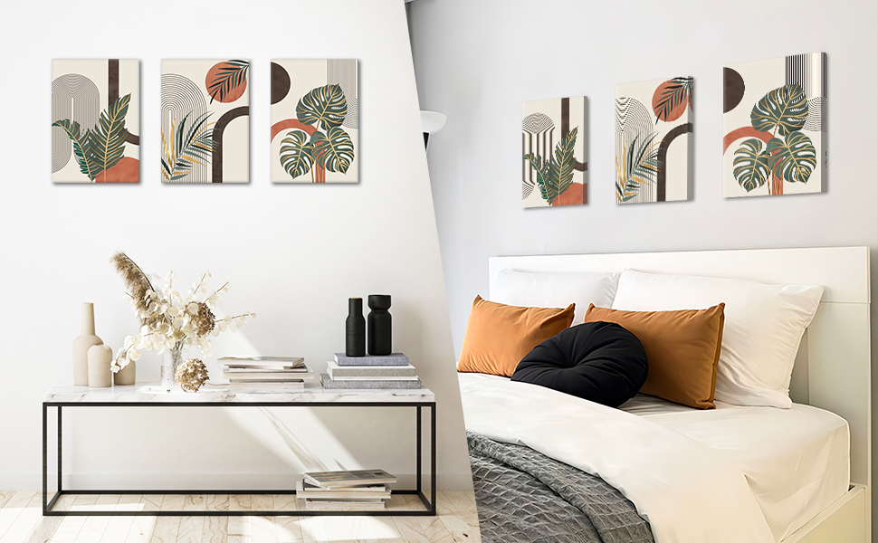 Modern bedroom with white bed, abstract botanical wall art, and minimalist side table. Earthy color scheme with white, black, and orange accents.