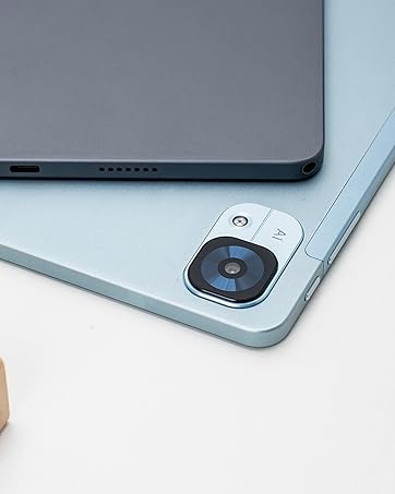 Silver mobile device shown with wooden charging or speaker accessory on light gray background, displaying multiple angles and connection details.