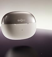 Der Text lautet „SHOKZ“. Sphärisches weißes und graues Smart-Gerät mit minimalistischem Design vor einem Hintergrund mit Farbverlauf.