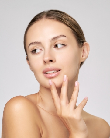 Woman with clean skin using serum