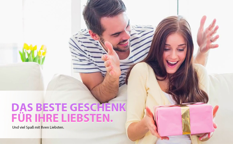 A couple reacts excitedly to a pink gift box being opened. Text in German suggests it's about the best gift for loved ones.