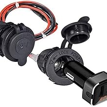 Dual USB car charger adapter with black plastic housing and red-black wiring, featuring protective caps and 12V socket design.