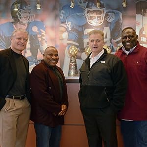 GROUP PICTURE IN FRONT OF TROPHY CASE
