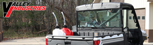 red and white 5-gallon utility jugs in the back of a UTV