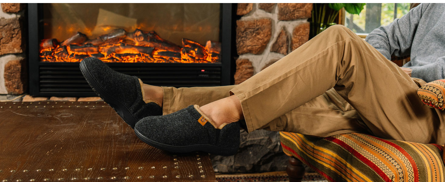 Close-up shots of flickering flames and glowing embers, likely from a fireplace or fire pit, showing orange and red hot coals.