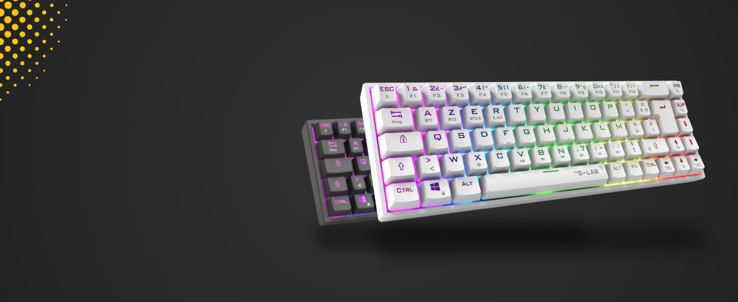 Clavier mécanique compact avec rétroéclairage RGB affichant des couleurs arc-en-ciel sur des touches blanches sur fond sombre