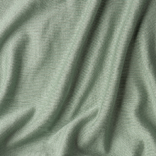 Close-up shot of Tula's baby wrap's soft tencel fabric in sage green color