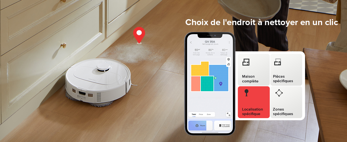 sur plancher de bois franc. Le smartphone affiche l'interface de l'application pour le contrôle de l'appareil.