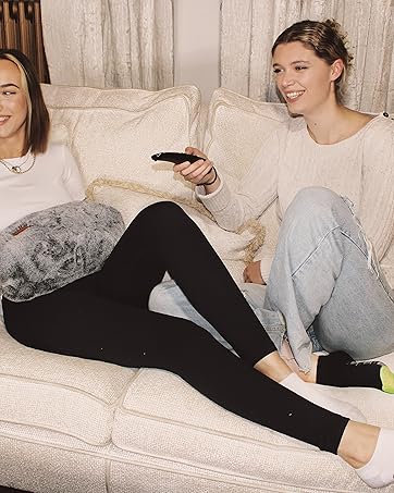 Relaxing on the sofa enjoying a movie night.