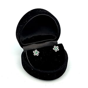 daisy shaped earrings in black velvet box