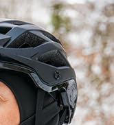 Black tactical-style backpack shown from multiple angles, featuring multiple compartments, straps, and modular attachment points. Detailed views of pockets and storage features.