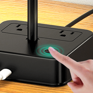 a hand is pointing at a router.