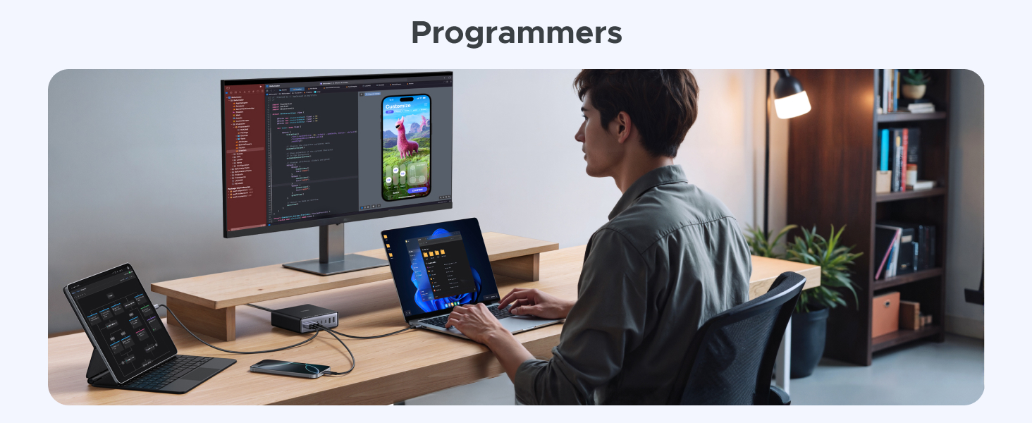 Programmer's workspace with dual-monitor setup, laptop, and tablet. Desk shows coding on screens. Person seated, using tablet. Office setting with bookshelf visible.
