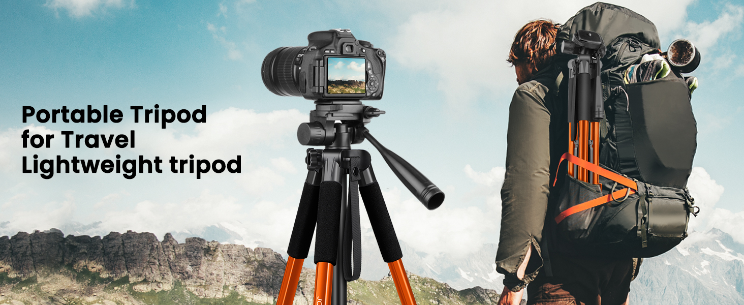 a camera on a tripod with a mountain in the background