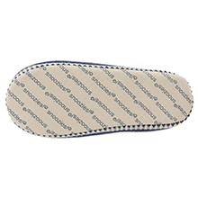 Beige fabric insole with repeating diagonal text pattern. Edge is trimmed with a dotted border.