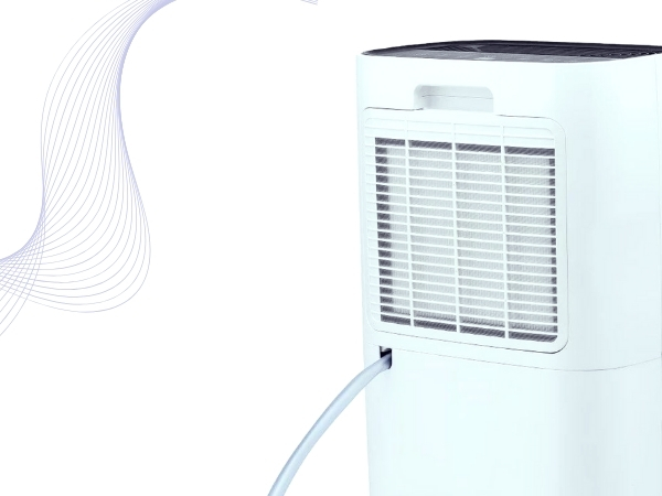 Compact white portable air conditioner or dehumidifier unit with front ventilation grille and curved design elements.