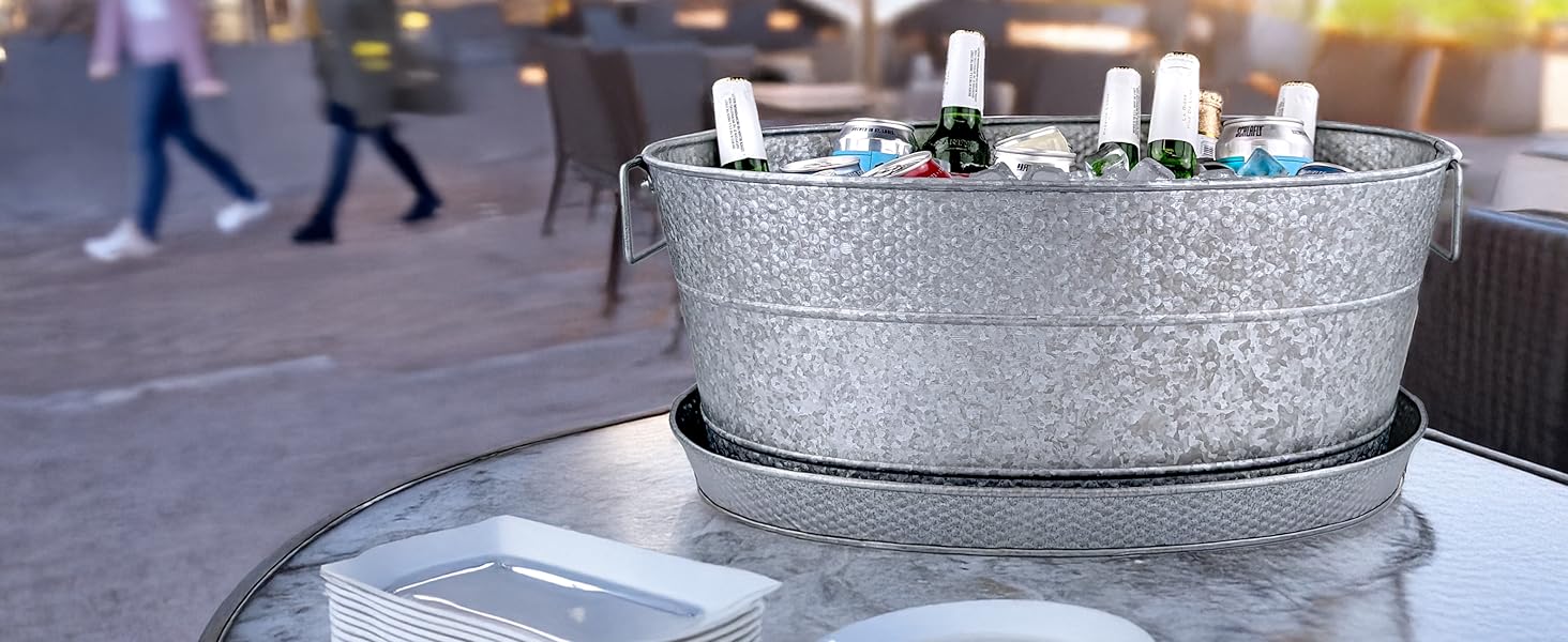 Large beverage tub for parties with matching tray to use to catch condensation.