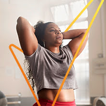 Image of woman with hands on head and check mark