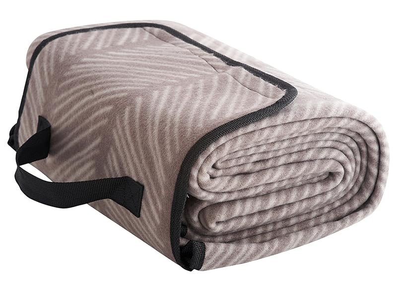 Rolled blanket with zebra-stripe pattern in light gray and beige tones, featuring black trim and carrying strap.