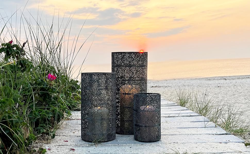 Lanterns on wood boardwalk at sunset with beach background