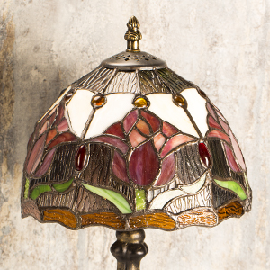 a stained glass table lamp with a stained glass shade.