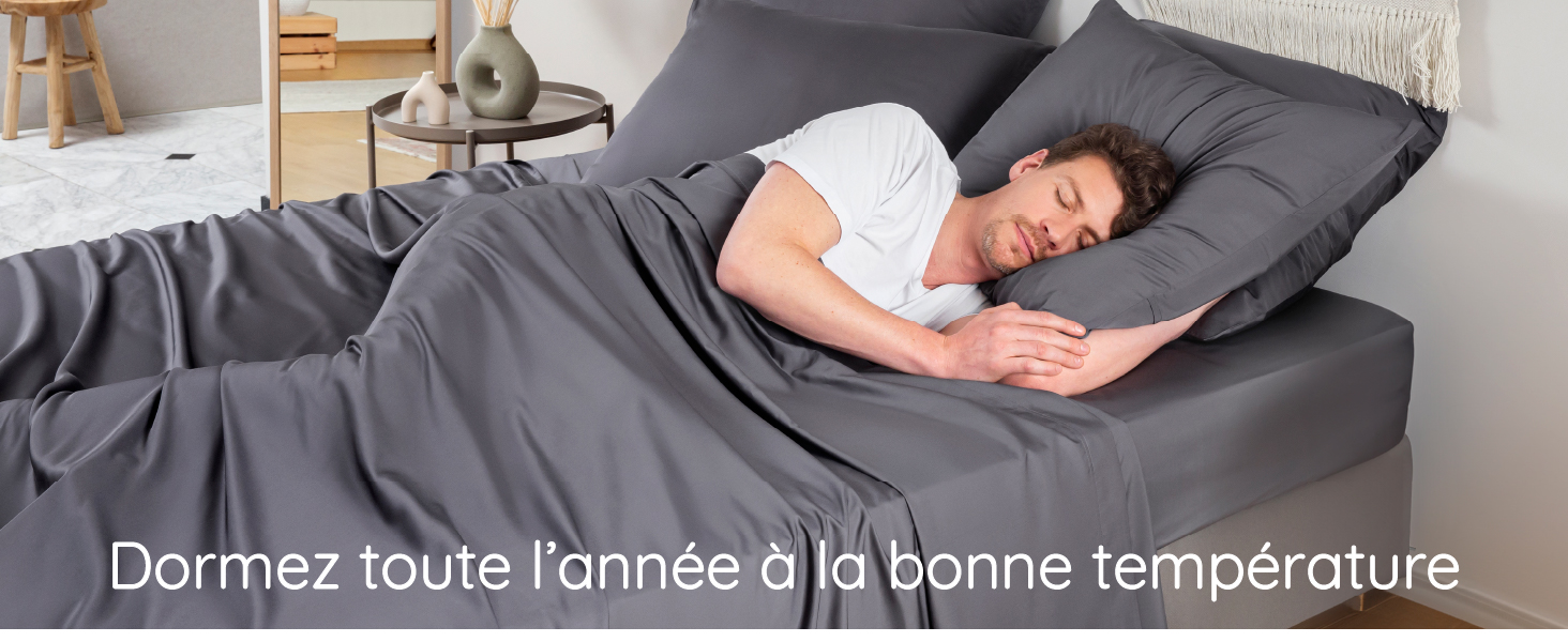 homme dormant paisiblement dans un drap refroidissant au charbon thermorégulateur