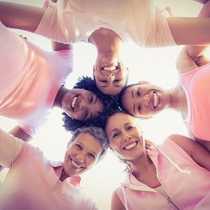 group of women smiling in a huddle