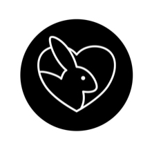 Icône noire circulaire représentant une silhouette de tête de lapin stylisée avec de longues oreilles sur fond blanc