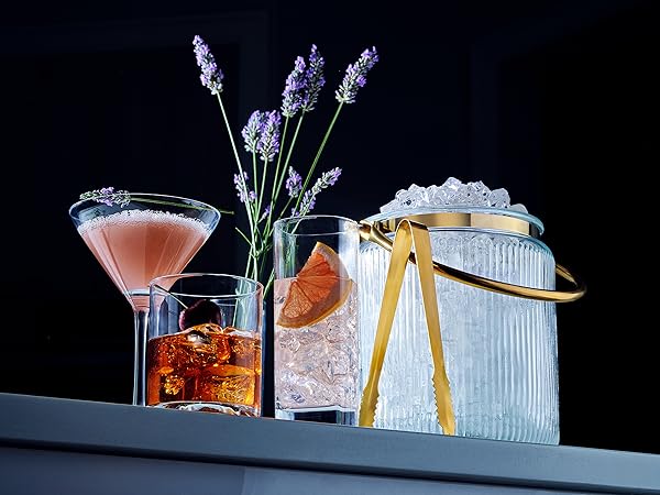 ice bucket on table at bar with cocktail and alcohol cold drinks