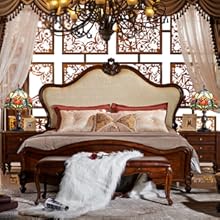 a bedroom with a bed and a table