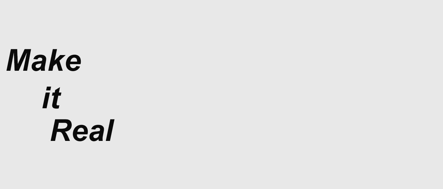 Text image displaying 'Make it Real' in black letters on a white background.