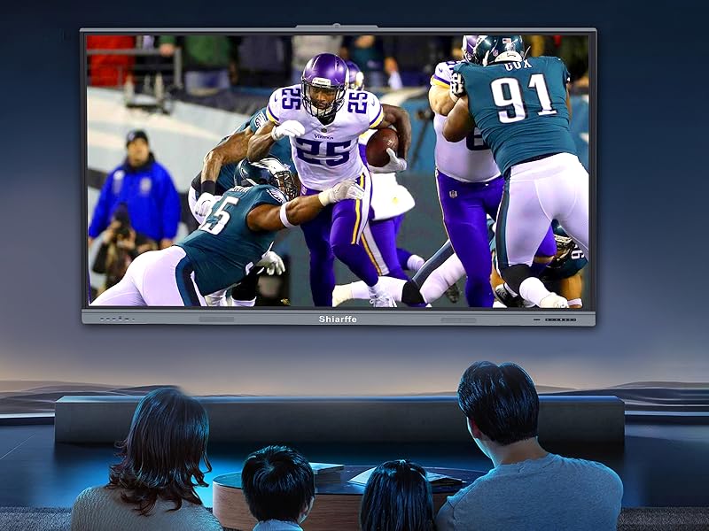 A family sits together on the living room sofa, watching a football game on the 4K UHD Smart Board