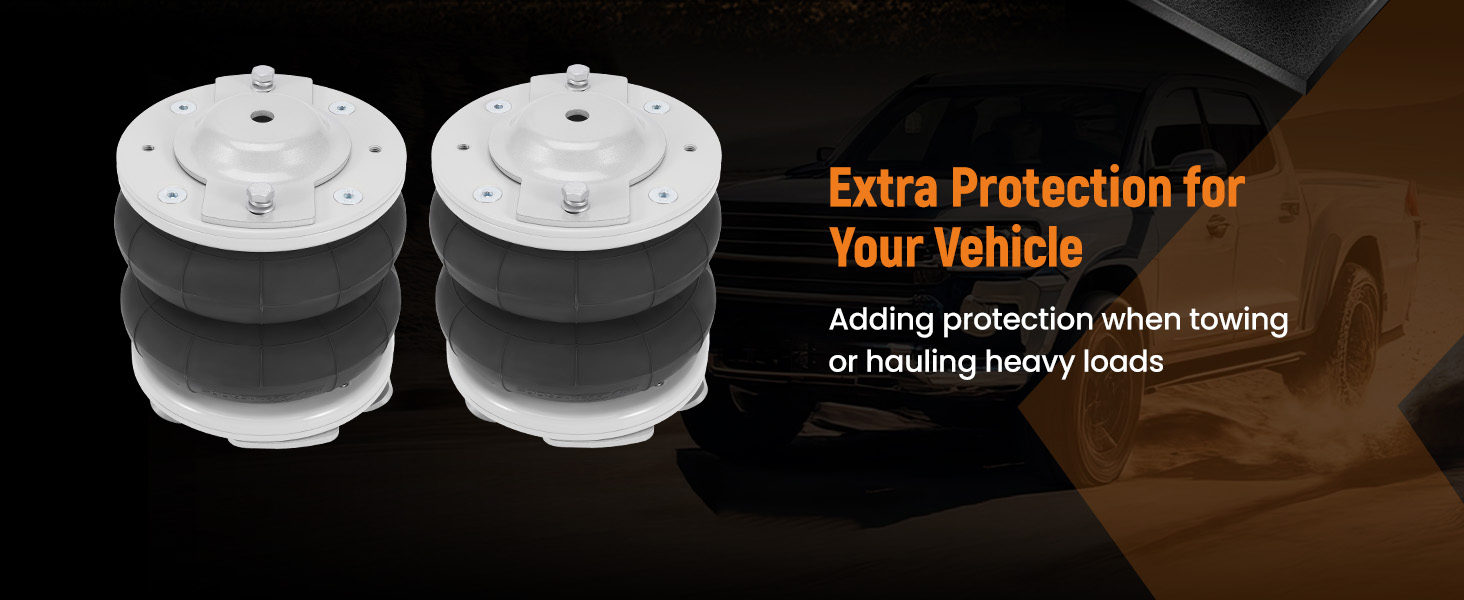 Two circular vehicle suspension components with white top and bottom plates, and a black central section. Text indicates they offer extra protection when towing or hauling heavy loads.