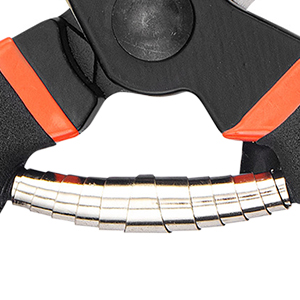 Close-up of a curved, black and orange device with a white brush attachment, likely part of a cleaning or grooming tool.